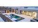 A luxury home featuring an inviting pool with inset spa and sundeck, and a patio that is perfect for entertaining at 1455 Macdonald Ranch Dr, Henderson, NV 89012