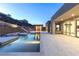 The backyard features a luxurious pool with inset spa and a patio that is perfect for outdoor entertaining at 1455 Macdonald Ranch Dr, Henderson, NV 89012