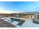 A spacious pool with deck is perfect for outdoor entertaining, complemented by a modern home design at 1455 Macdonald Ranch Dr, Henderson, NV 89012