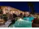 Outdoor space with patio, pool, waterfalls and covered porch with ceiling fans and lights at 1700 Brock Ct, Las Vegas, NV 89117