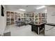 Finished basement with ping pong and air hockey tables and built-in shelving for versatile recreational space at 1700 Brock Ct, Las Vegas, NV 89117