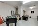 Game room area featuring a foosball table, pool table, and dartboard at 1700 Brock Ct, Las Vegas, NV 89117
