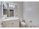Bright bathroom with single sink, white cabinets, and standard toilet at 1700 Brock Ct, Las Vegas, NV 89117
