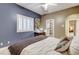 Cozy bedroom with a view of the ensuite closet and serene colors at 1700 Brock Ct, Las Vegas, NV 89117