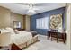 Stylish bedroom with a cozy bed, desk, and complementary wall colors at 1700 Brock Ct, Las Vegas, NV 89117