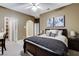 Comfortable bedroom with bed and decor; doorways lead to other rooms at 1700 Brock Ct, Las Vegas, NV 89117