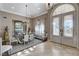 Elegant dining area featuring a chandelier, decorative furnishings, and lots of natural light at 1700 Brock Ct, Las Vegas, NV 89117