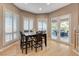 Dining area features hardwood floors, shuttered windows, and access to the outdoor patio at 1700 Brock Ct, Las Vegas, NV 89117