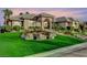 Beautiful exterior view of a house with a well-manicured lawn and rock features, showcasing its curb appeal at 1700 Brock Ct, Las Vegas, NV 89117