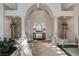 Grand foyer with soaring ceilings, decorative columns, elegant decor, and tile flooring at 1700 Brock Ct, Las Vegas, NV 89117