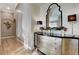 Hallway with hardwood floors and a decorative mirror accenting the space at 1700 Brock Ct, Las Vegas, NV 89117