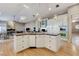 Open kitchen features granite countertops, pendant lighting, and stainless steel appliances at 1700 Brock Ct, Las Vegas, NV 89117