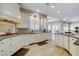 Bright kitchen with stainless steel appliances, granite countertops, and natural wood flooring at 1700 Brock Ct, Las Vegas, NV 89117