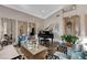 Spacious room featuring a piano, decorative mirrors, elegant furniture, and a cozy atmosphere at 1700 Brock Ct, Las Vegas, NV 89117