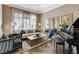 Formal living area with plush seating, a grand piano, and elegant décor at 1700 Brock Ct, Las Vegas, NV 89117