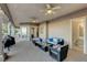 Expansive covered patio with ample seating, BBQ, and an entrance to an attached bathroom at 1700 Brock Ct, Las Vegas, NV 89117
