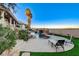 Backyard showcasing a custom pool with rock features and a beautifully landscaped yard at 1700 Brock Ct, Las Vegas, NV 89117