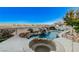 Backyard featuring a custom pool with rock features, spa, and a water slide at 1700 Brock Ct, Las Vegas, NV 89117