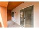 A private balcony with a sliding glass door, storage closet, and outdoor seating area at 23 E Agate Ave # 303, Las Vegas, NV 89123