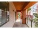 Balcony with metal railing overlooking community landscaping and nearby buildings at 23 E Agate Ave # 303, Las Vegas, NV 89123