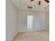 Carpeted bedroom with ceiling fan and access to an ensuite bathroom at 23 E Agate Ave # 303, Las Vegas, NV 89123