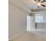 Carpeted bedroom featuring a ceiling fan, natural light, and a neutral color palette at 23 E Agate Ave # 303, Las Vegas, NV 89123