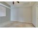 Carpeted bedroom featuring a ceiling fan and natural light at 23 E Agate Ave # 303, Las Vegas, NV 89123