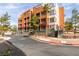 Modern building exterior with a combination of stone and painted surfaces and multiple balconies at 23 E Agate Ave # 303, Las Vegas, NV 89123