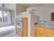 Open kitchen featuring stainless steel appliances, granite countertops, and natural wood cabinets at 23 E Agate Ave # 303, Las Vegas, NV 89123