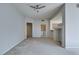 Open living room featuring light gray walls, neutral carpet, and access to storage at 23 E Agate Ave # 303, Las Vegas, NV 89123