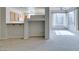 Bright living space features a view to the kitchen with modern appliances and a large window at 23 E Agate Ave # 303, Las Vegas, NV 89123