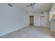 Open living space with light gray walls, neutral carpet, and access to storage at 23 E Agate Ave # 303, Las Vegas, NV 89123