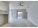 Neutral living room with plush carpet, opening to balcony, with contemporary lighting fixture at 23 E Agate Ave # 303, Las Vegas, NV 89123