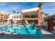 Stunning swimming pool, framed by a modern building and lush palm trees, creating a serene oasis at 23 E Agate Ave # 303, Las Vegas, NV 89123