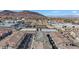 Beautiful aerial view of the neighborhood showcasing the townhome, nearby community features, and mountain views at 234 Walsh Peak Ave, Henderson, NV 89015