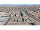 Aerial shot displays community, highlighting modern homes, landscaping, and overall neighborhood setting at 234 Walsh Peak Ave, Henderson, NV 89015