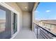 Modern balcony overlooking neighborhood houses with rod iron railing at 234 Walsh Peak Ave, Henderson, NV 89015