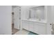 Bright bathroom featuring a double vanity, ample lighting, and modern fixtures at 234 Walsh Peak Ave, Henderson, NV 89015