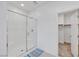Clean bathroom showcasing a glass-enclosed shower and access to the walk-in closet at 234 Walsh Peak Ave, Henderson, NV 89015