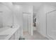 Open bathroom design with a modern double vanity and glass shower, offering a spa-like feel at 234 Walsh Peak Ave, Henderson, NV 89015