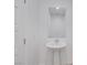 Bathroom features a pedestal sink and a mirror at 234 Walsh Peak Ave, Henderson, NV 89015