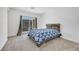 Inviting bedroom featuring carpeted floors, lots of light, and a sliding glass door at 234 Walsh Peak Ave, Henderson, NV 89015