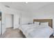 Spacious bedroom with a modern bed and ensuite access, complemented by soft carpet flooring at 234 Walsh Peak Ave, Henderson, NV 89015