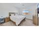 Serene bedroom with natural light, features a comfortable bed, nightstands, and modern decor at 234 Walsh Peak Ave, Henderson, NV 89015