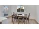 Dining area with a table and chairs is located next to a window and a door at 234 Walsh Peak Ave, Henderson, NV 89015