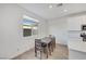 Dining area features a window, tile floors and is adjacent to the kitchen at 234 Walsh Peak Ave, Henderson, NV 89015