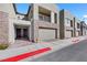 Contemporary townhome exteriors with stone accents, private balconies, and brick-paved sidewalks at 234 Walsh Peak Ave, Henderson, NV 89015