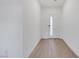 Bright entryway featuring sleek hardwood floors, a white door with glass and neutral walls at 234 Walsh Peak Ave, Henderson, NV 89015
