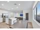 Open concept kitchen and dining with stainless appliances, a center island, and seating at 234 Walsh Peak Ave, Henderson, NV 89015