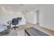 Bright, open living space featuring a comfortable seating area and functional workspace bathed in natural light at 234 Walsh Peak Ave, Henderson, NV 89015